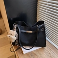 Matte black leather tote bag with silver turn-lock and brown teddy bear charm accessory - Black with Pendant