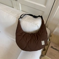 Brown quilted half-moon crossbody bag with wavy texture and adjustable strap - Brown