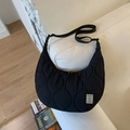 Black quilted crescent crossbody bag with adjustable strap for casual daily use - Black