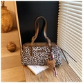 Detail of leopard print tote bag with brown leather handles and plush bear charm - Creamy White With Charm