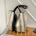 Ethnic style tote bag featuring black and white striped faux shearling with handmade tag - White Vertical Stripes