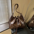 Vintage dark brown quilted bucket backpack with drawstring and gold metal zippers - Brown