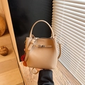 Chic light khaki bucket bag in litchi leather with colorful pompom charm decoration - Khaki with Pendant