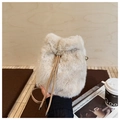 Detail of plush faux fur bucket bag with leather drawstring and metal adjustment buckle - Khaki