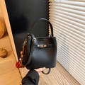 Fashionable black pebble leather bucket bag with silver hardware and colorful charm - Black with Pendant
