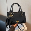 Elegant black square handbag with gold rotating lock and adjustable shoulder strap - Black