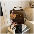 Retro dark brown leather backpack with white stitching and cute teddy bear charm - With Charm / Brown
