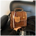 Vintage brown leather backpack for women with teddy bear charm and white stitching - With Charm / Brown