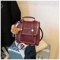 Vintage burgundy leather backpack with contrast stitching and plush bear charm - With Charm / Burgundy