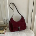 Deep red suede hobo bag with adjustable brown leather strap and silver buckle detail - Red