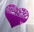 Macro detail of laser-cut purple heart card with rose pattern on glass rim - Dark Purple