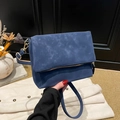 Navy blue suede shoulder bag with gold zipper detail and adjustable crossbody strap - Blue
