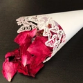 White laser-cut butterfly wedding confetti cone filled with dried red rose petals - White