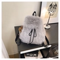 Detail of grey plush backpack with drawstring closure and leopard print pom-pom charm - Light Gray With Charm