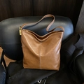 Caramel brown large bucket bag with lychee texture and white contrast stitching - Brown