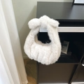Borsa in ecopelliccia bianca con manico a nodo elegante e consistenza soffice - Bianco