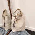Beige quilted tote bag with diamond pattern and cute sheep pendant on denim - Beige With Charm