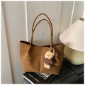 Brown faux suede tote bag with a cute plush bear charm in a cozy indoor setting - With Charm / Brown