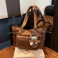 Chic brown leather tote bag with pocket detail and cute plush bear charm accessory - Brown with Pendant