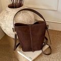 Deep brown frosted suede bucket bag with a minimalist design and adjustable shoulder strap - Brown