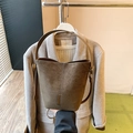 Brown frosted leather bucket bag with wide handle and minimalist metallic buckle - Green