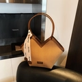 Minimalist straw tote bag with V-shaped opening and brown faux leather trim detail - Brown