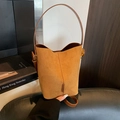 Classic caramel suede bucket bag with top handle and gold hardware in vintage style - Brown