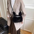 Furry black crossbody bag with rabbit ear handles and metal turn-lock detail - Black