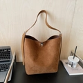 Brown frosted leather bucket bag with silver metal lock and adjustable shoulder strap - Brown