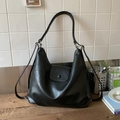 Close-up of black PU leather shoulder bag featuring textured finish and magnetic flap closure - Black without Pendant