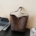 Chic leopard print bucket bag with vintage matte finish and slim leather shoulder strap - Leopard Print