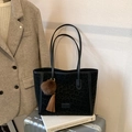 Black leopard print tote bag with plush pompom charm and leather tassels detail - Black with Pendant