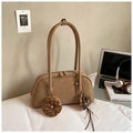 Detail view of brown suede baguette bag with cute doughnut and heart charms - Khaki With Pendant