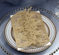 Elegant gold laser-cut invitation card with floral patterns on white decorative tray - Beige Gold