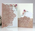 Detail of laser-cut rose gold glitter wedding invitation with floral insert and RSVP card - Glitter Apple Gold (HK-120 Glitter)