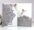 Macro view of laser-cut silver glitter wedding invitation with floral insert card - Glitter Charcoal Silver (HK-120 Glitter)
