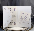 Detailed laser-cut lace pattern on ivory wedding invitation with elegant floral accents - White