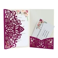 Macro detail of laser-cut glitter wedding invitation with intricate floral lace patterns - Fuschia
