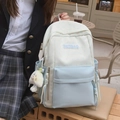 Blue and beige patchwork school backpack featuring star patterns and a cute plush charm - Blue with Charm