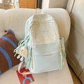 Pastel blue and beige contrast backpack with star patterns and plush charm on sofa - Green with Pendant