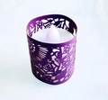 Macro shot of purple laser-cut lace candle sleeve with white LED tea light inside - Dark Purple