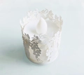 Close-up of laser-cut paper lampshade with grape pattern and LED electronic candle light - White