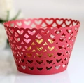 Macro detail of laser-cut red paper cupcake wrapper with heart patterns and gold chocolate - 5cm / Red