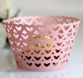 Close-up of laser-cut heart hollow cake wrappers in matte pink for wedding decoration - 5cm / Pink