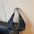 Versatile black nylon hobo bag with adjustable strap and leather buckle detail - Black