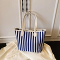 Blue and white striped canvas tote bag with heart-shaped leather strap stitching - Blue Without Charm