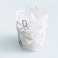 White laser-cut paper candle wrap with daisy flower pattern and LED tea light - White