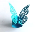 Close-up of bright blue butterfly laser-cut napkin ring with intricate floral wing patterns - Sky Blue