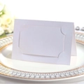 Elegant white foldable wedding place cards with rectangular debossed border on white plate - White