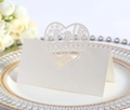 Elegant laser-cut heart place cards in white, perfect for wedding table decorations - Ivory